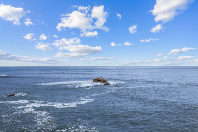 The offshore rock at low tide
